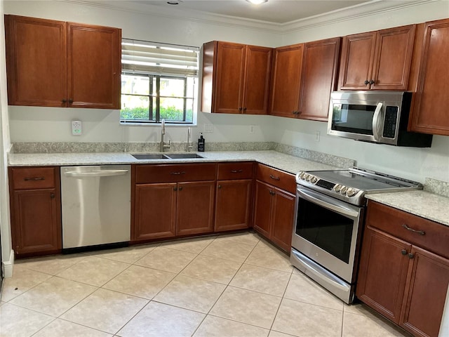 kitchen featuring stainless steel appliances, crown molding, a sink, and light tile patterned flooring