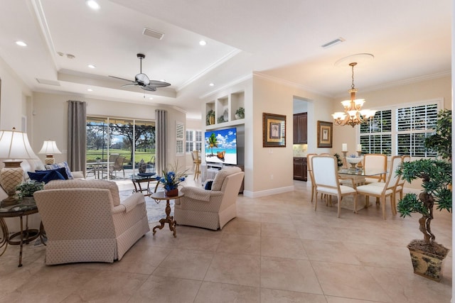 tiled living room featuring ceiling fan with notable chandelier, a raised ceiling, and ornamental molding