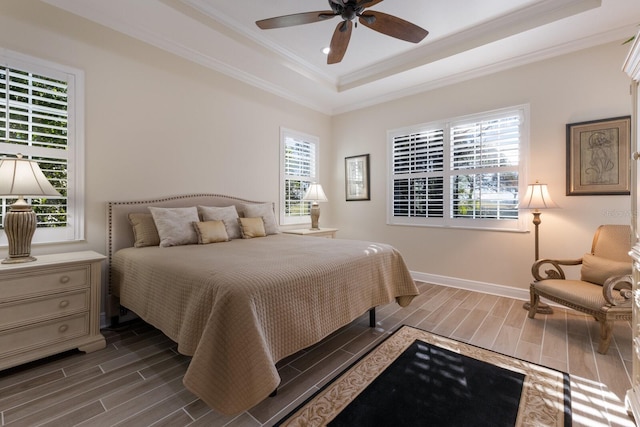 bedroom with hardwood / wood-style flooring and multiple windows