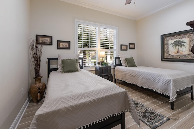 bedroom with ceiling fan, wood-type flooring, and ornamental molding