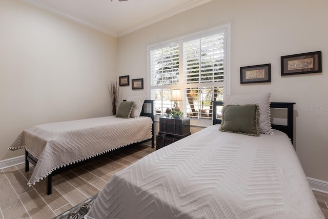 bedroom with ornamental molding and hardwood / wood-style flooring