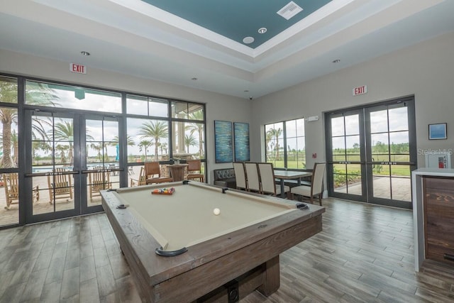 recreation room with french doors, hardwood / wood-style flooring, and pool table