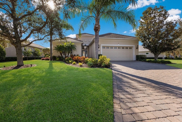 ranch-style home with a garage and a front lawn