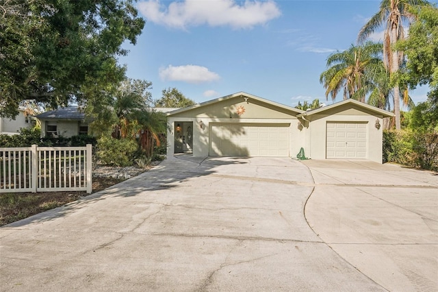 ranch-style house featuring a garage