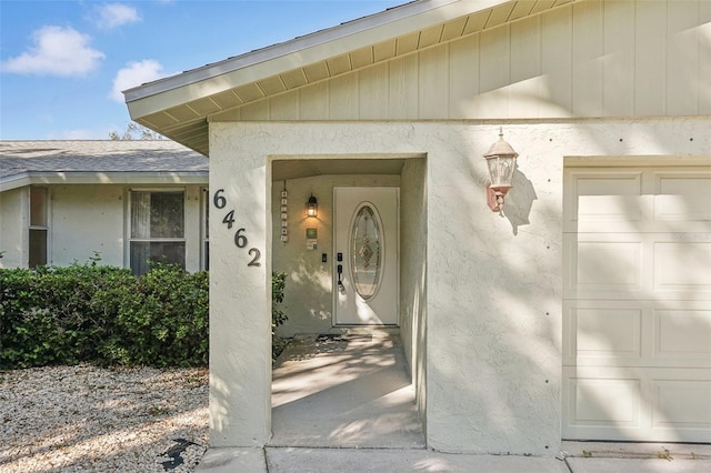 view of exterior entry featuring a garage