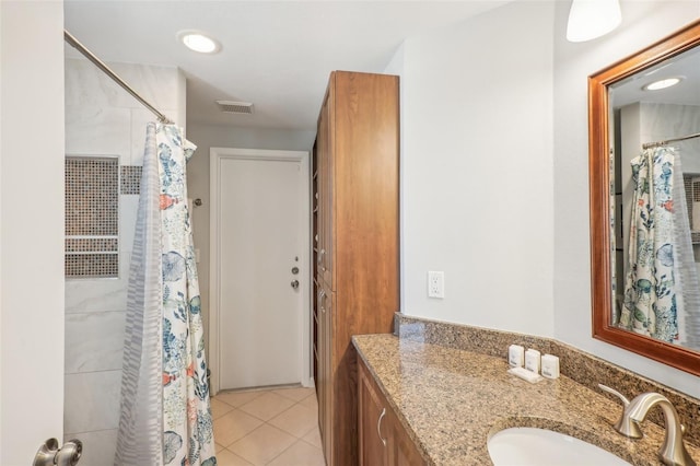 bathroom featuring a shower with curtain, vanity, and tile patterned flooring