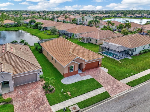 birds eye view of property with a water view