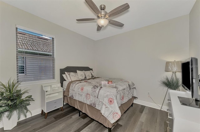 bedroom featuring ceiling fan and dark hardwood / wood-style floors