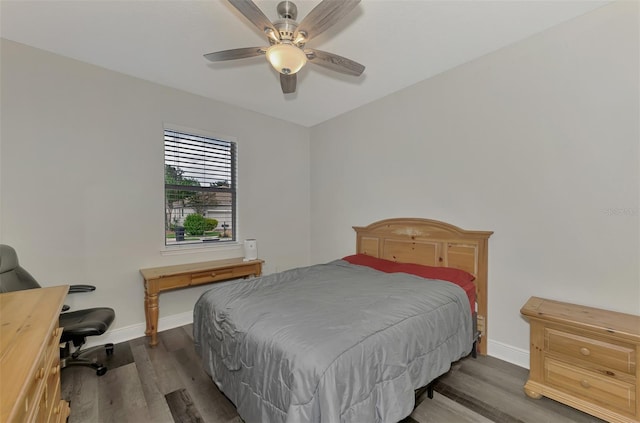 bedroom with dark wood-type flooring and ceiling fan