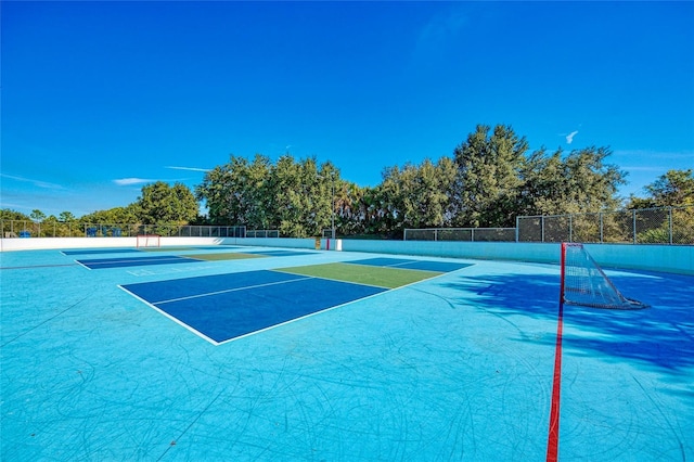 view of tennis court with basketball court