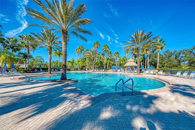 view of swimming pool featuring a gazebo and a patio