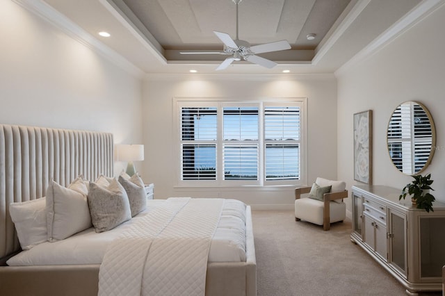 bedroom featuring light carpet, a raised ceiling, ceiling fan, and ornamental molding