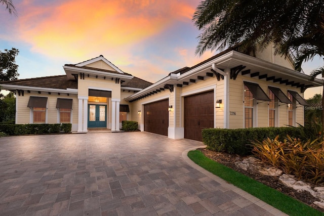 view of front of house featuring french doors and a garage