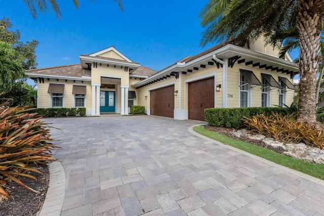 view of front of property with french doors and a garage