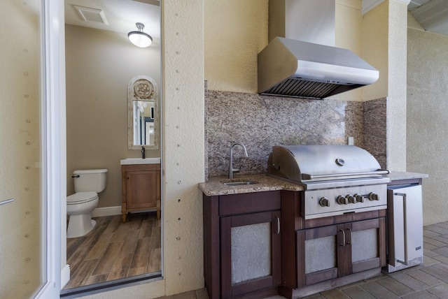 view of patio with a grill and sink