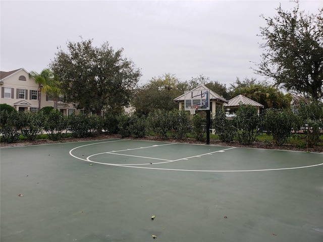 view of basketball court featuring basketball hoop