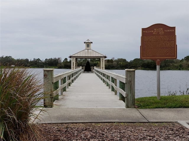 dock area featuring a gazebo and a water view