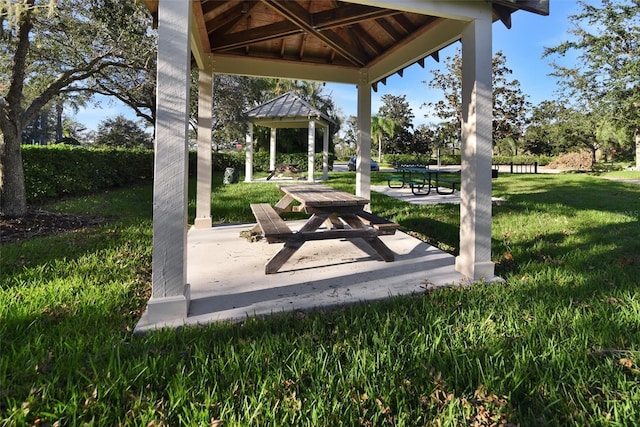 view of property's community featuring a lawn and a gazebo
