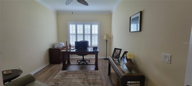 home office featuring crown molding, baseboards, ceiling fan, and wood finished floors
