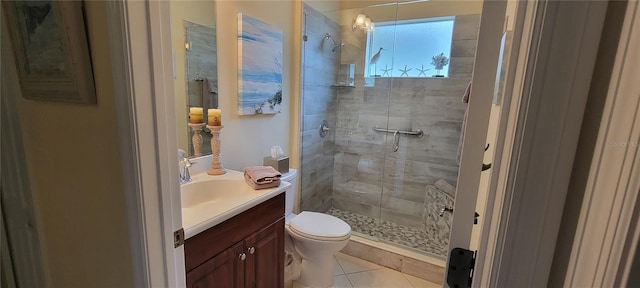 full bathroom with vanity, tile patterned floors, a stall shower, and toilet
