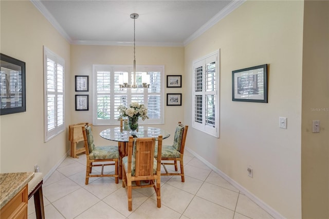 tiled dining room featuring plenty of natural light, ornamental molding, and a notable chandelier