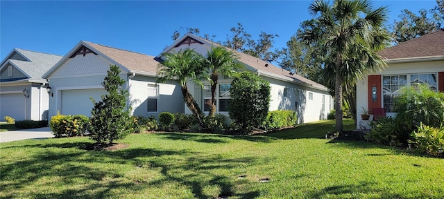 view of property exterior featuring a lawn and a garage