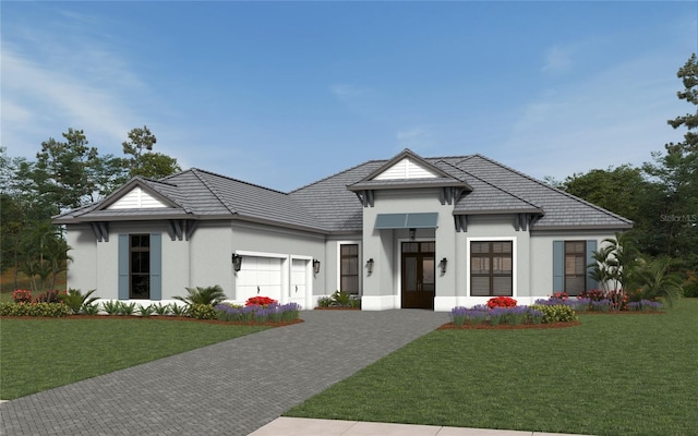 17113 Waterworks Ter, Venice, FL 34293 - view of front of property with an attached garage, stucco siding, decorative driveway, and a front yard
