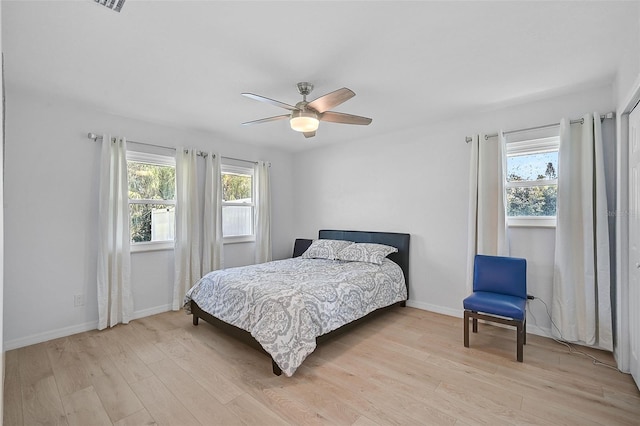 bedroom featuring light hardwood / wood-style flooring and ceiling fan