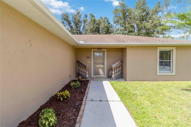 property entrance with a yard