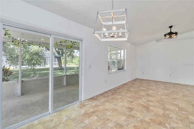 unfurnished dining area with a chandelier