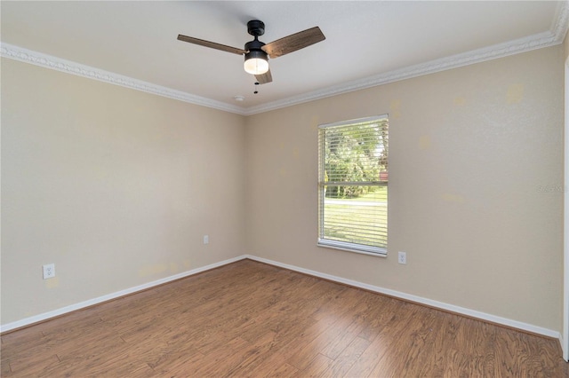 unfurnished room featuring ceiling fan, hardwood / wood-style flooring, and ornamental molding