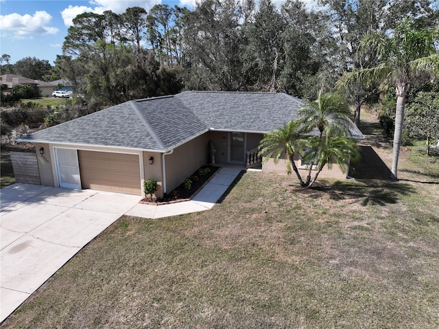 ranch-style home featuring a garage and a front lawn