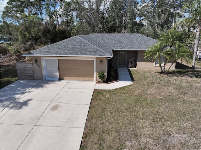 ranch-style home with a garage and a front yard