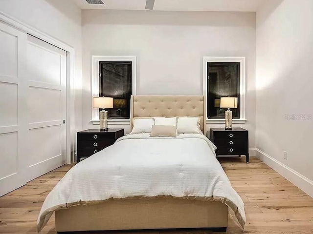 bedroom featuring a closet, ceiling fan, and hardwood / wood-style flooring