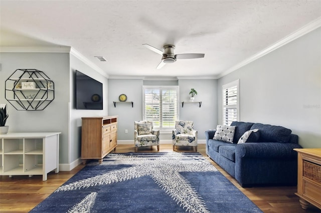 living room featuring crown molding, dark wood-type flooring, and ceiling fan