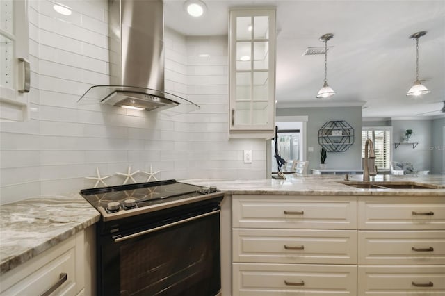 kitchen featuring sink, ventilation hood, decorative light fixtures, stove, and light stone counters