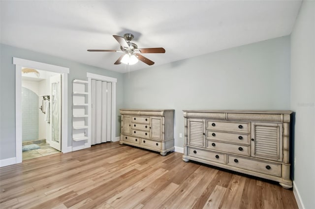 unfurnished bedroom featuring ceiling fan, light hardwood / wood-style floors, and ensuite bath