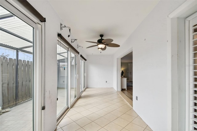 hallway featuring light tile patterned flooring