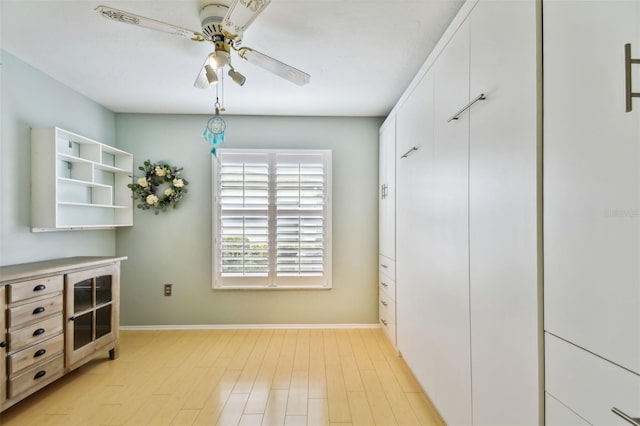 interior space featuring light hardwood / wood-style floors and ceiling fan