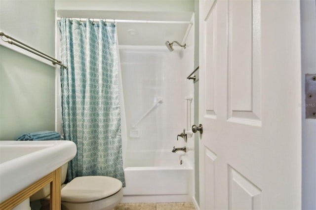 bathroom featuring toilet, shower / bath combo, and tile patterned flooring