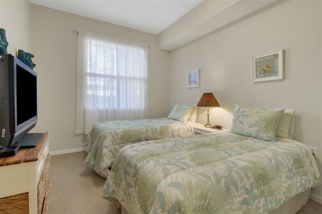 bedroom featuring light carpet