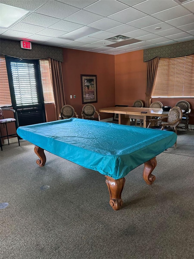 rec room with carpet floors and a paneled ceiling