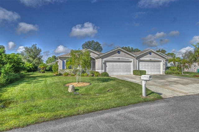 view of front of property featuring a garage and a front lawn