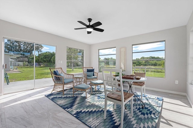 sunroom / solarium with ceiling fan