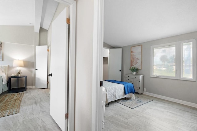 bedroom with lofted ceiling