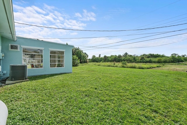 view of yard featuring central AC unit