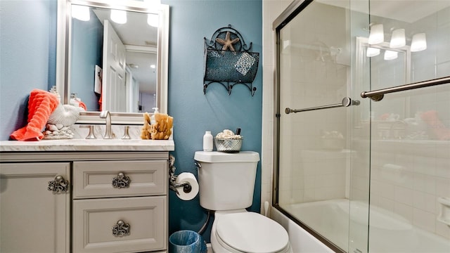 full bathroom featuring vanity, toilet, and enclosed tub / shower combo