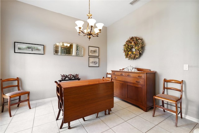 dining room with vaulted ceiling, an inviting chandelier, and light tile patterned floors