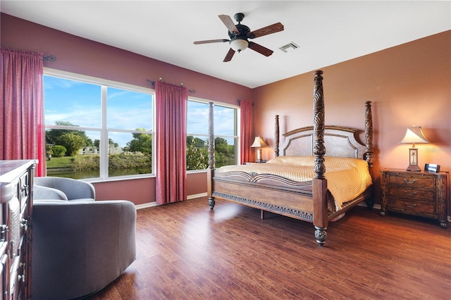 bedroom with ceiling fan and hardwood / wood-style floors