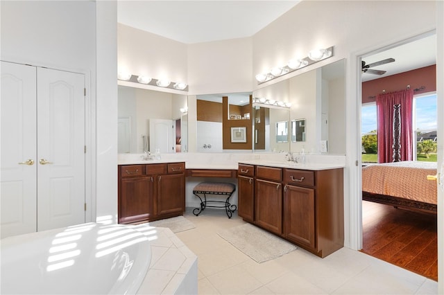 bathroom featuring ceiling fan, hardwood / wood-style flooring, and vanity